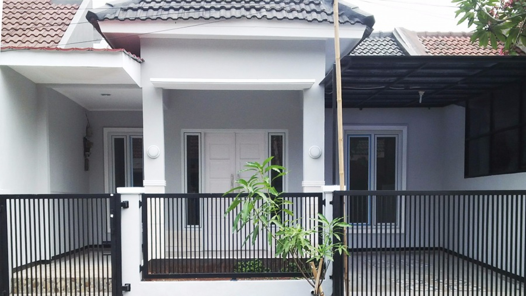 Rumah minimalis dalam cluster di graha raya