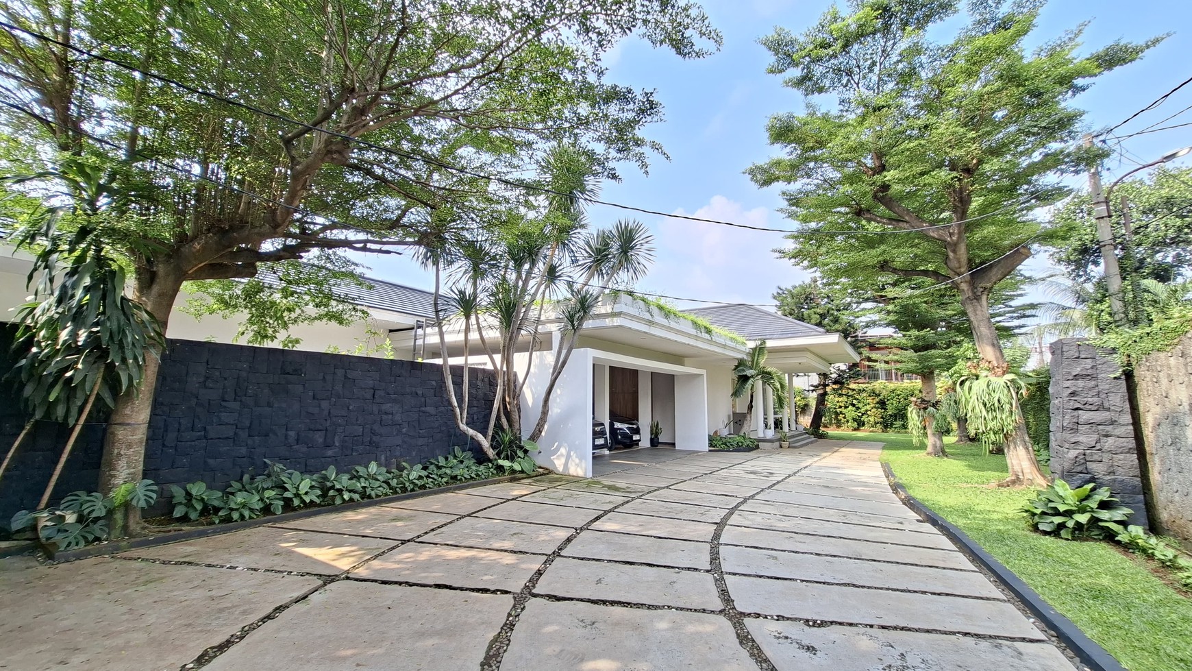 Large Piece Of Land with Modern Tropical House at Jl. Ampera Raya